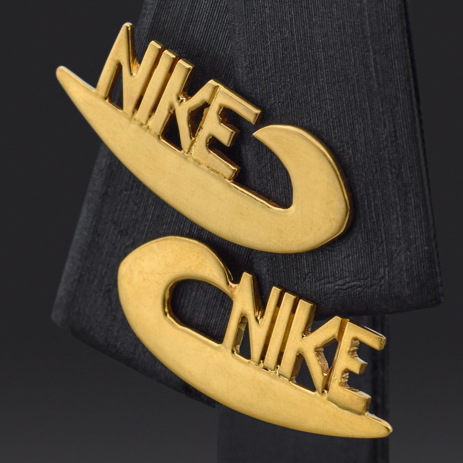 Nike swoosh earrings gold hotsell