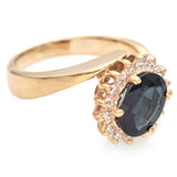 14K Yellow Gold 1.36 Ct. Oval Sapphire and Diamond Bypass Halo Ring